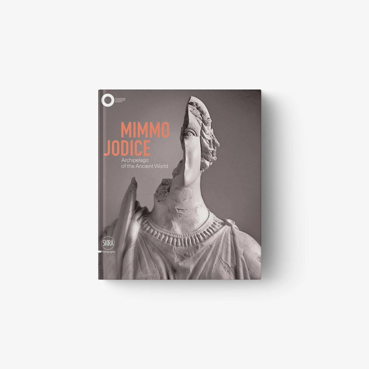 Hardcover art book with grayscale statue figure and orange title lettering