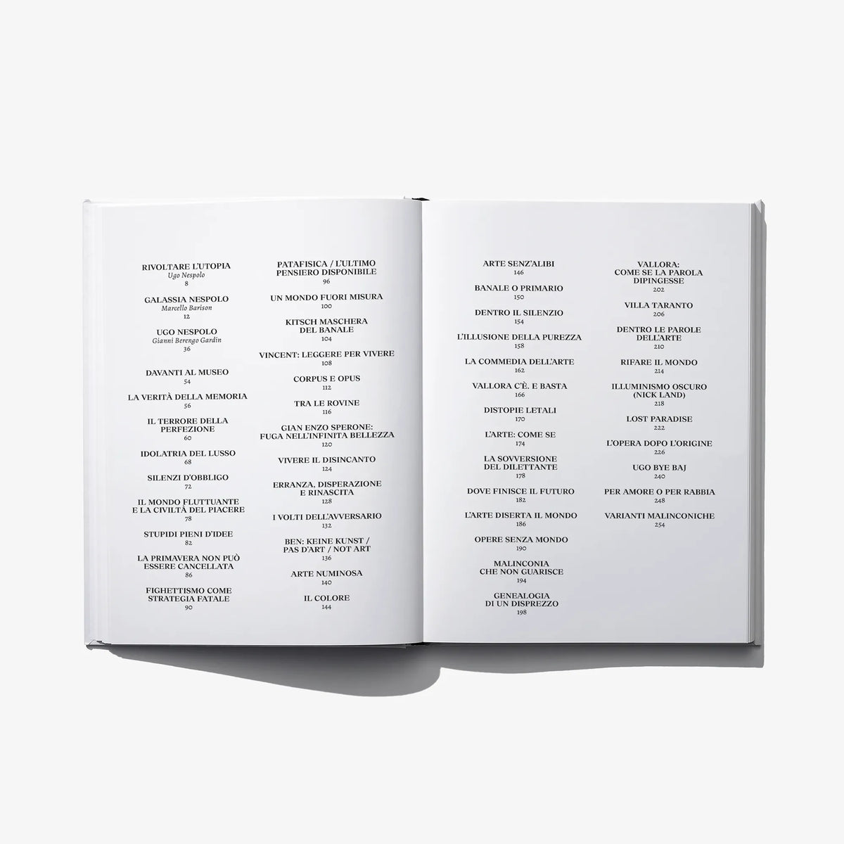Open art book showing table of contents with dense Italian text