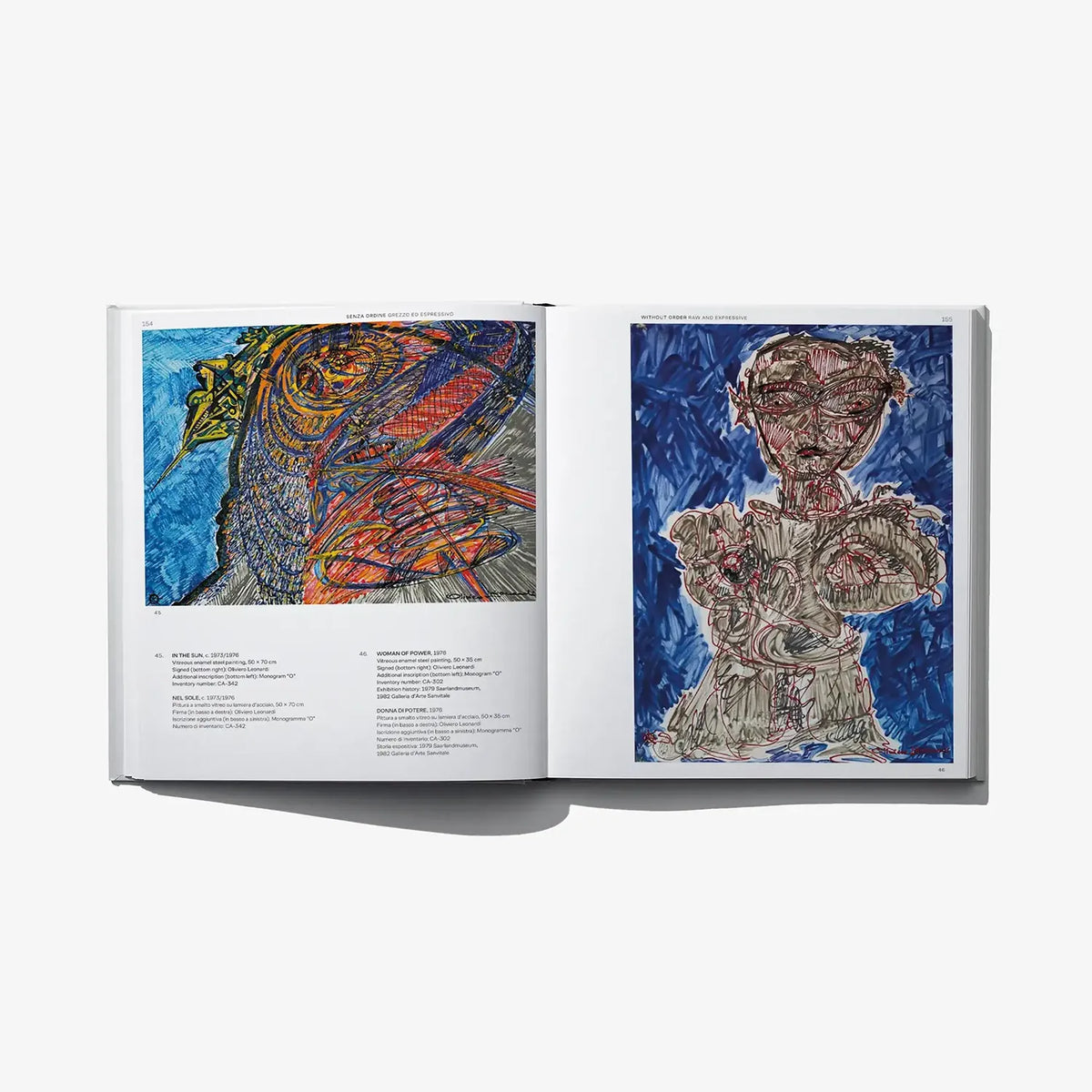 Open book showing two enamel artwork panels with printed descriptions beneath each