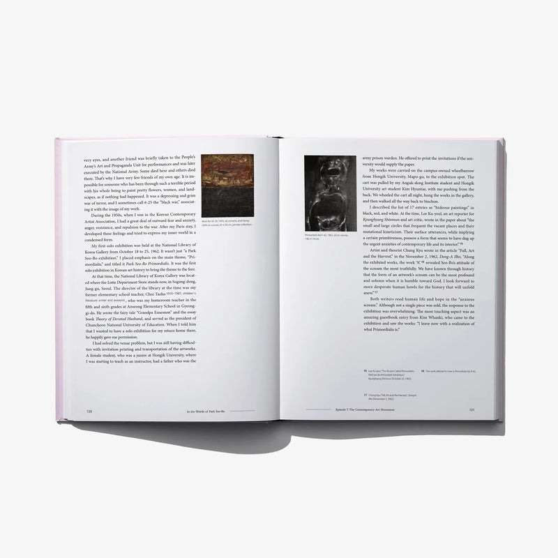 Opened autobiography graphic novel with printed text pages and grayscale images