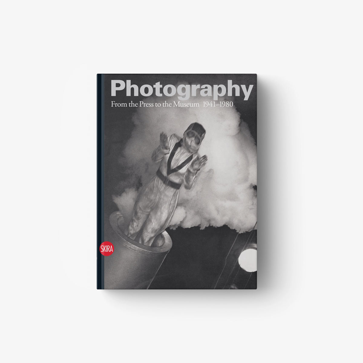 Hardcover photography book, monochrome cover with seated figure and title text