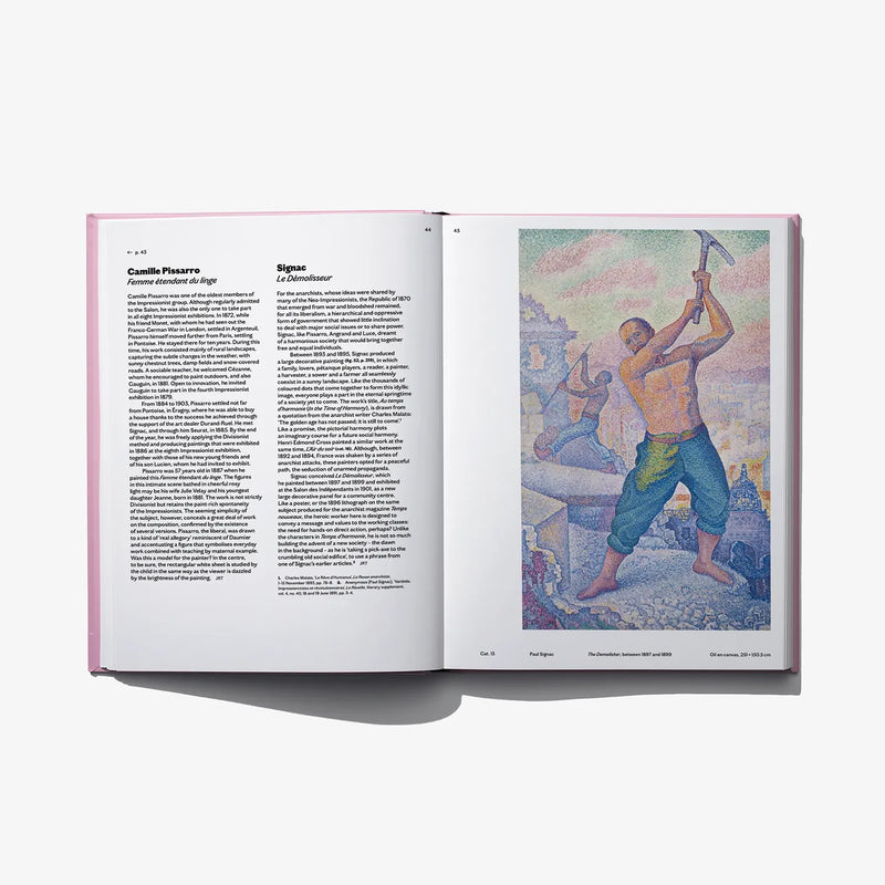 Open art book with printed text on left and colorful painting scene on right
