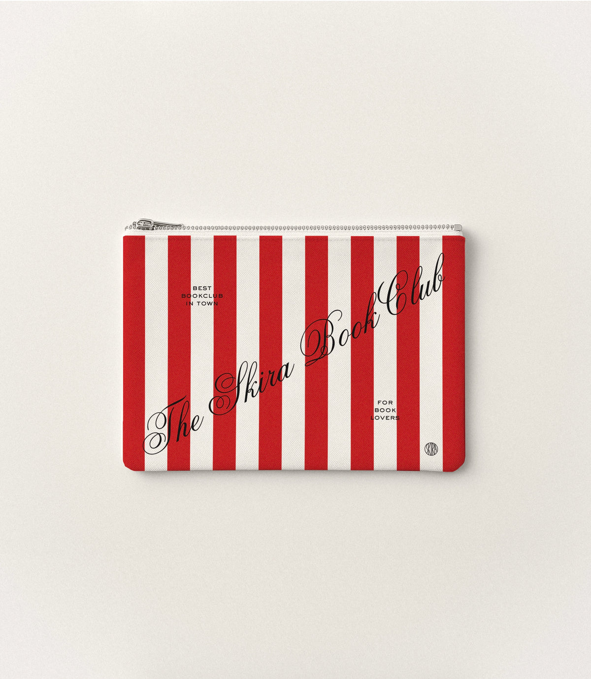 Striped zip pouch with red and white vertical stripes and “Skira Book Club” script text