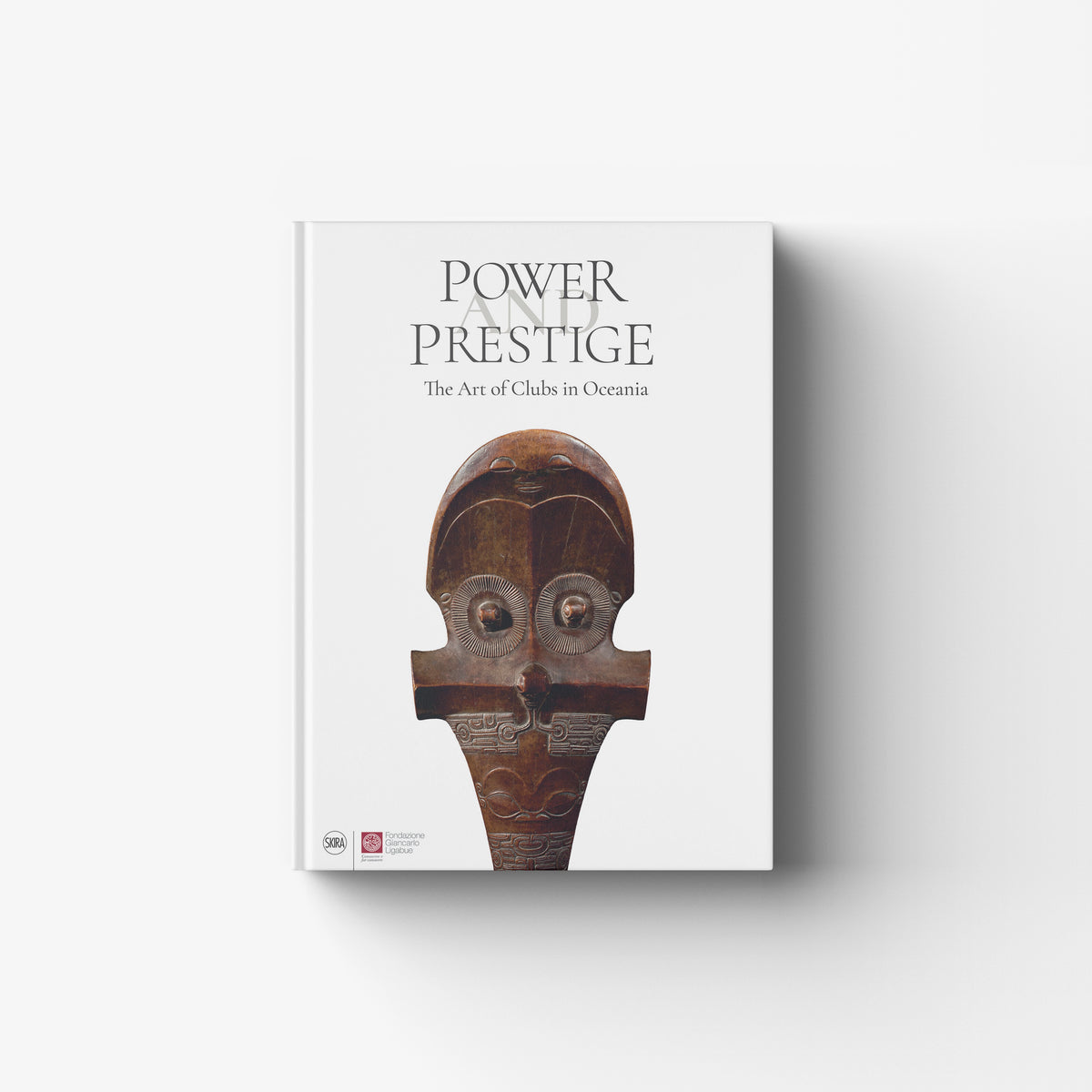 Illustrated book by Skira Arte in white with brown carved club cover, Oceanic carved clubs theme