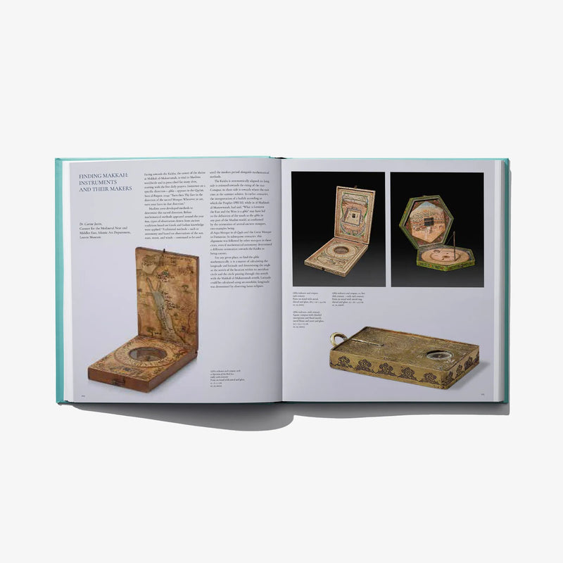 Open museum book spread with photos of small artifacts on white pages