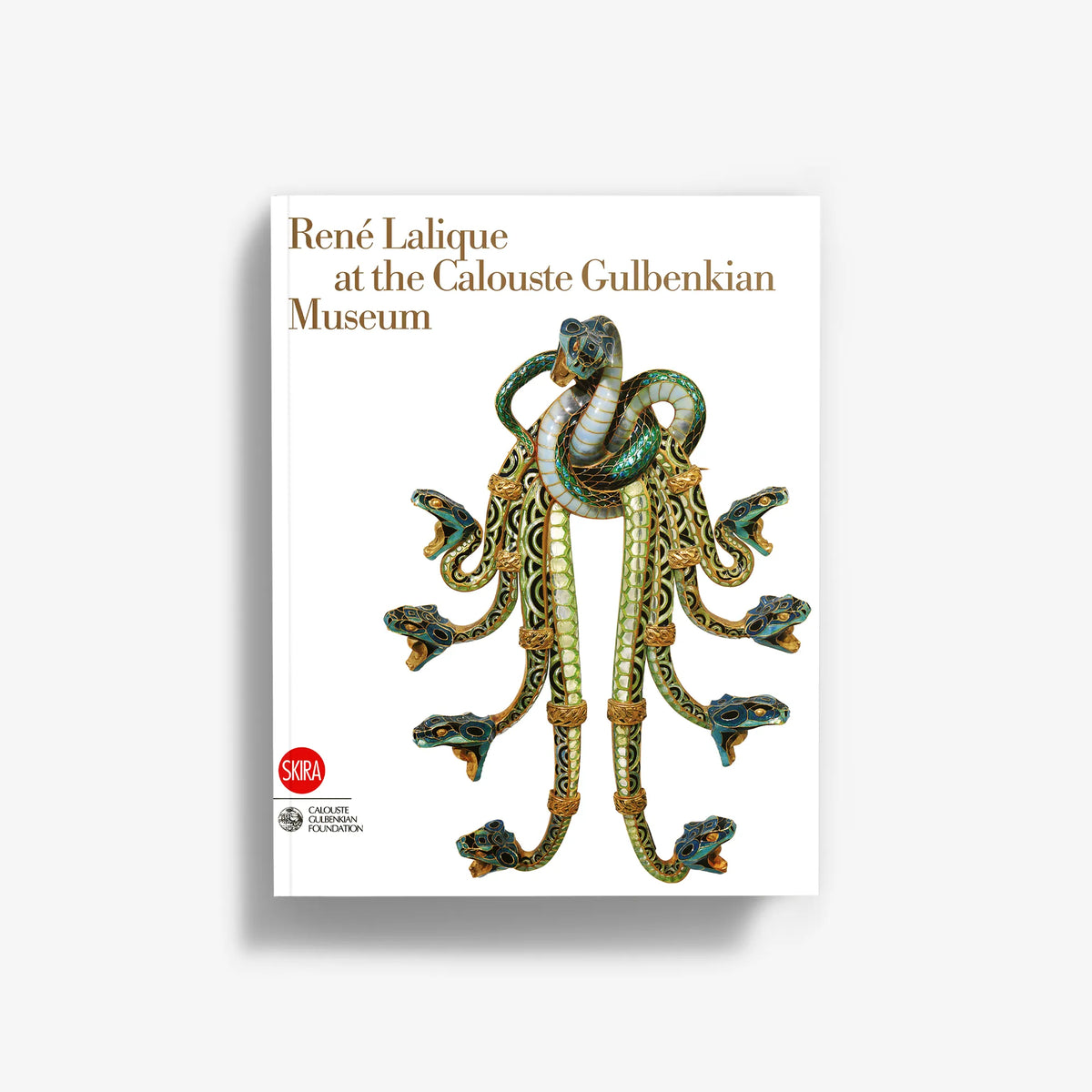 Art book cover with ornate blue-green and gold jewelry illustration