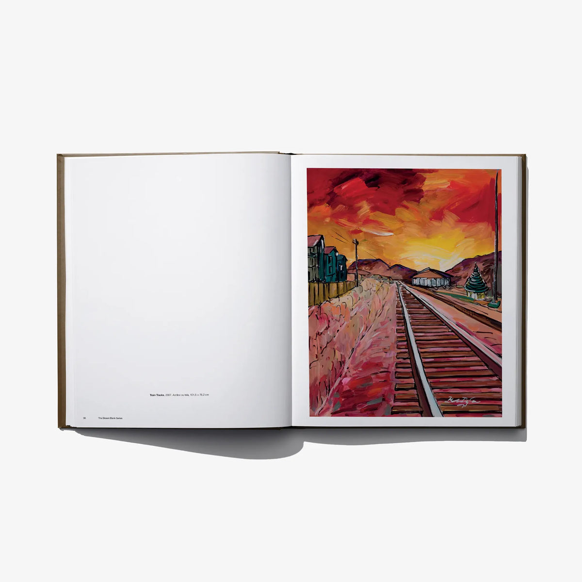 Open book spread with blank left page and red illustrated railway scene