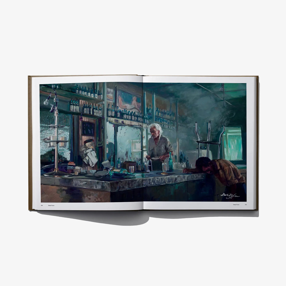 Open book spread with blue-toned bar interior photo and bartender figure