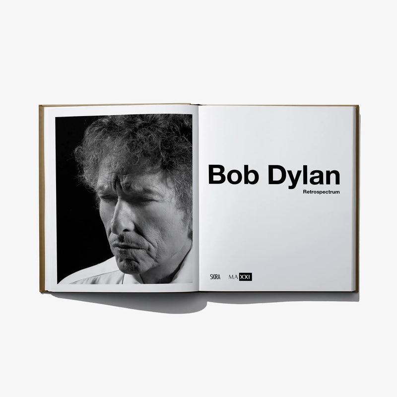 Hardcover photo book open to title page with black-and-white portrait print