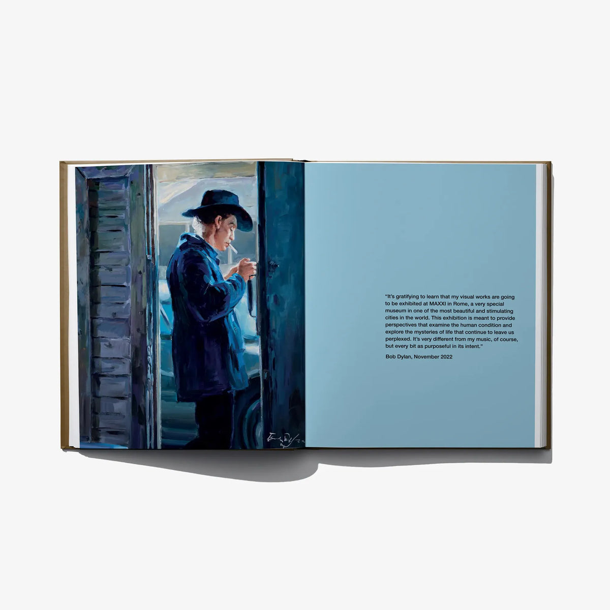 Hardcover photo book open to blue-toned street portrait scene