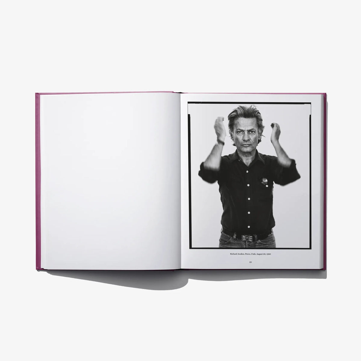 Richard Avedon photo book open spread with black-and-white portrait of man adjusting cuffs