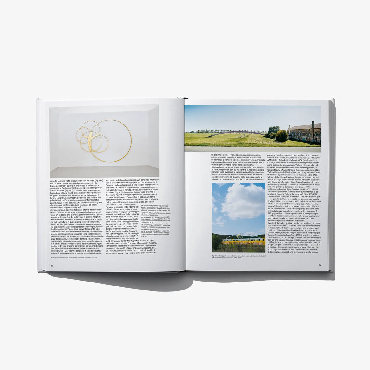 Italian edition art book open spread with wall sketch circles and landscape photo