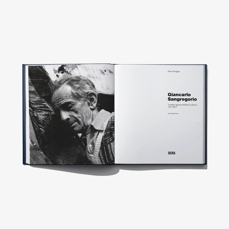 Open art catalog book with black-and-white portrait photo and text pages