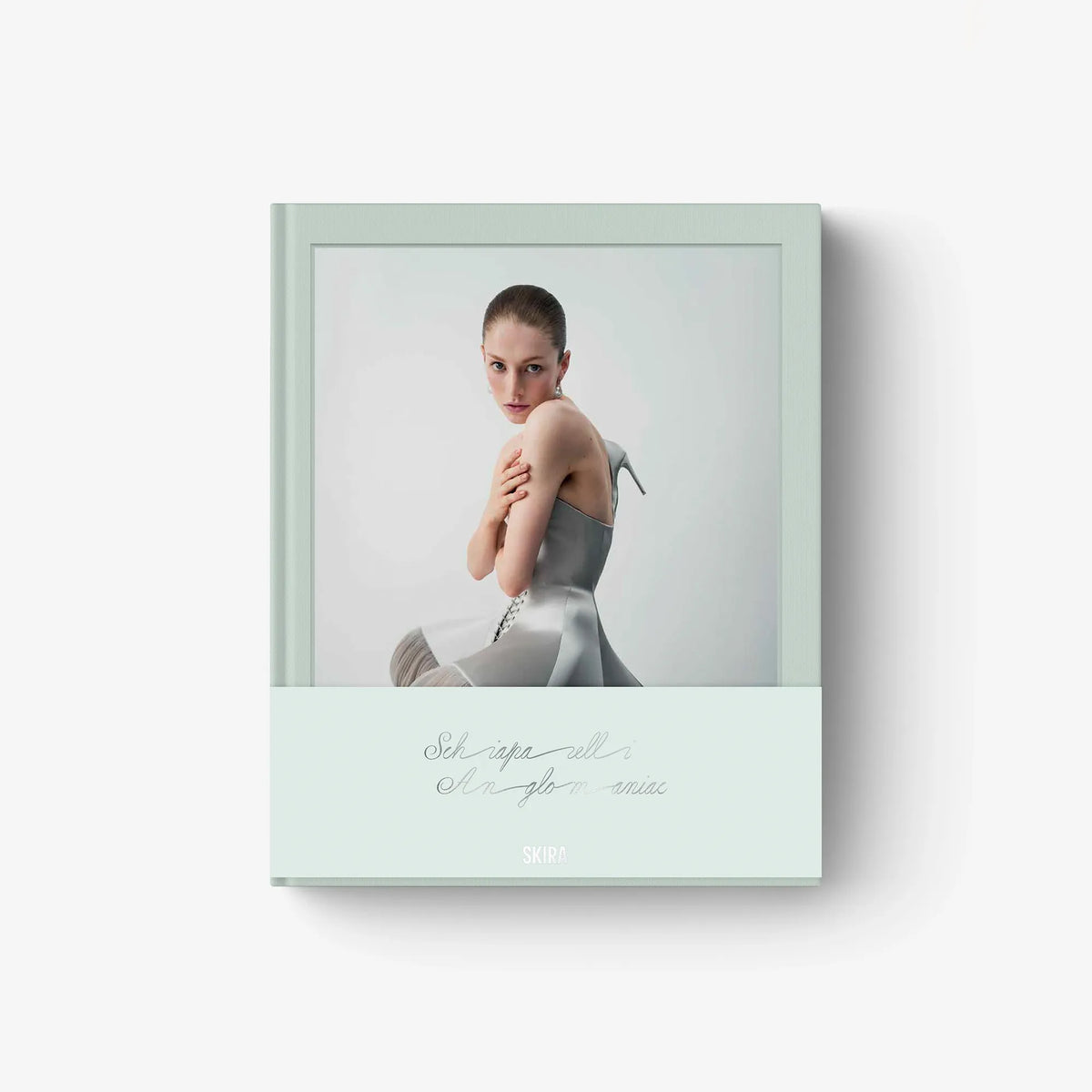 Fashion catalog cover with model in a gray dress, SCHIAPARELLI ANGLOMANIAC