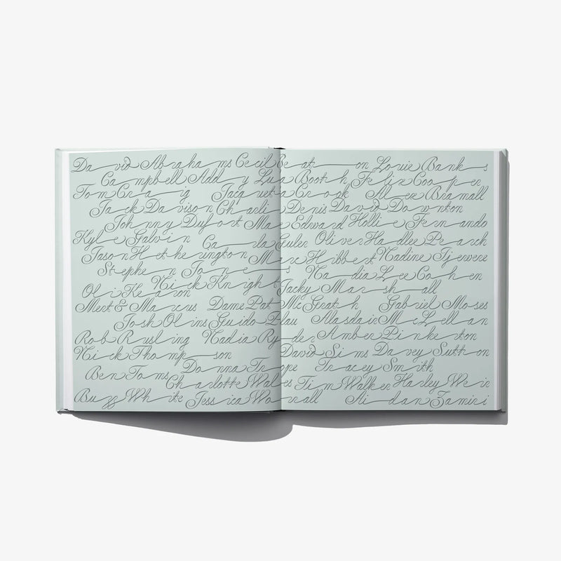 Open fashion catalog spread with handwritten-style script across pages