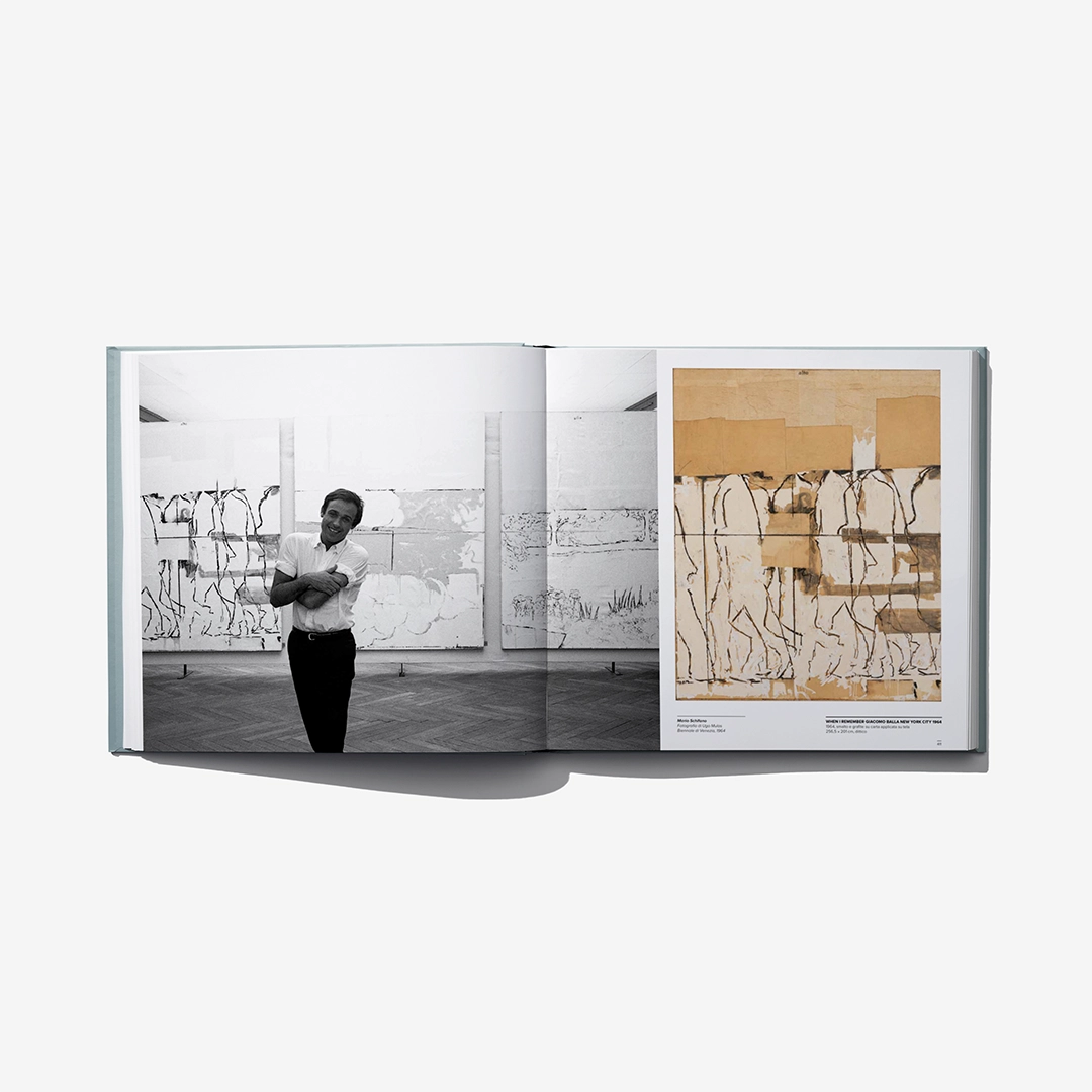 Open art catalog book with person in a gallery and beige abstract artwork