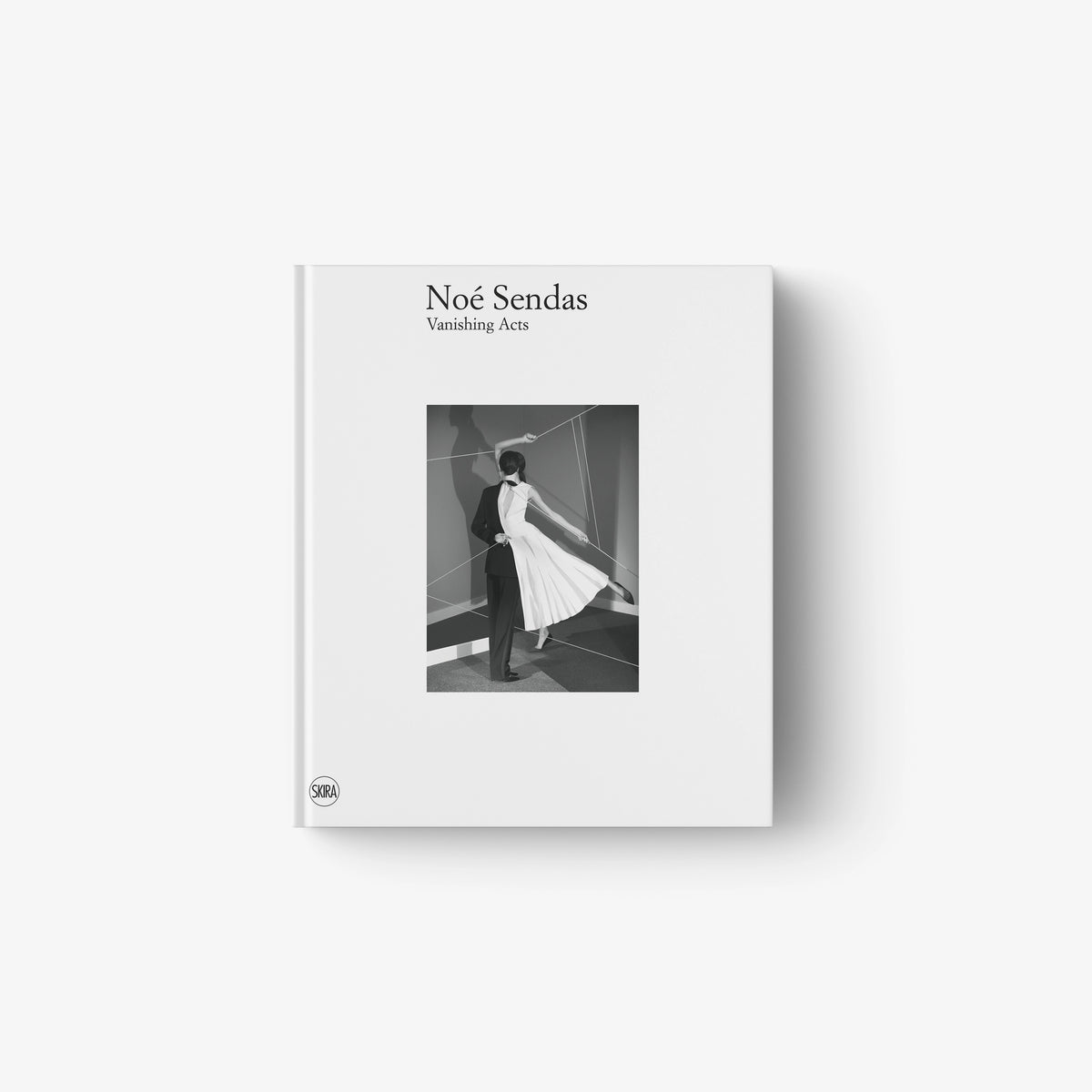 Minimalist white book cover featuring a black and white photo of a person walking in a flowing dress.