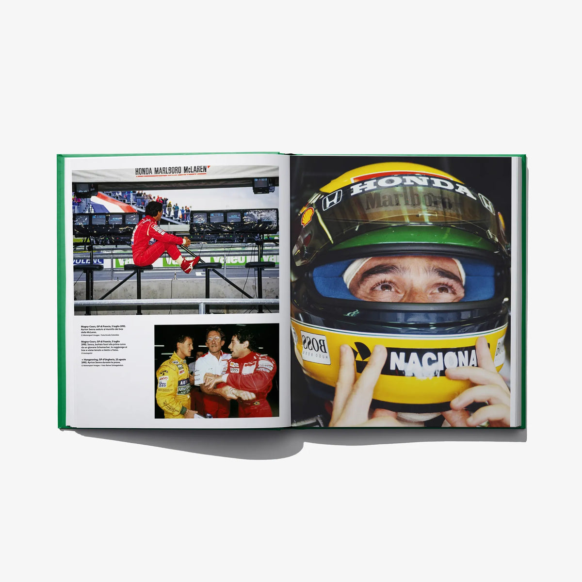 Ayrton Senna Forever book opened to photos of race car and driver in helmet