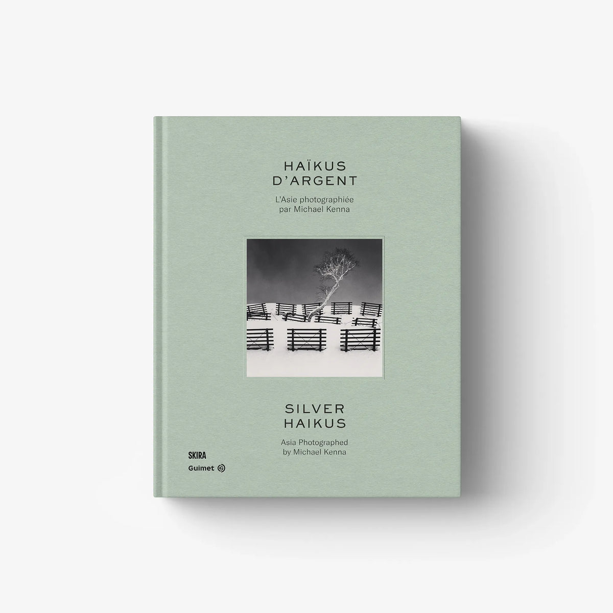 Mint green photo book cover with small landscape thumbnail and centered title.