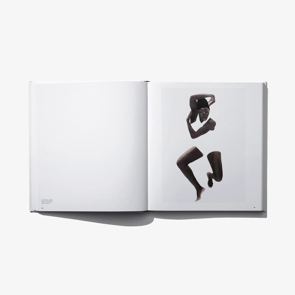 Art photo book open spread with three black-and-white figure poses on right page