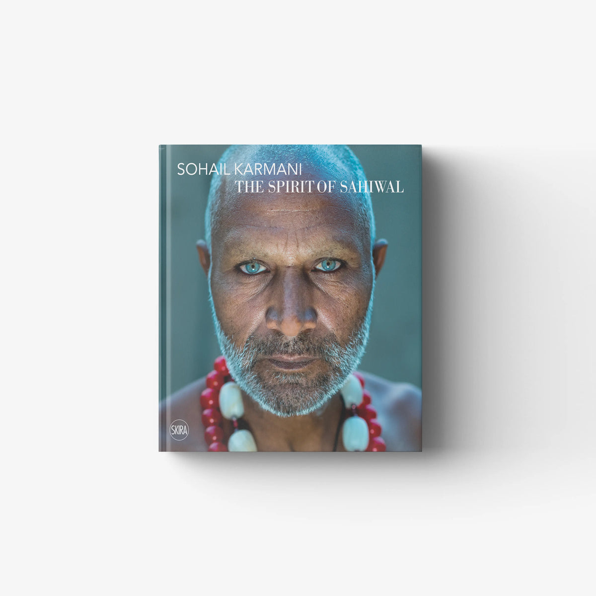 Art book portrait in teal cover with quasi pictorial texture, Skira Arte, Sohail Karmani The Spirit of Sahiwal