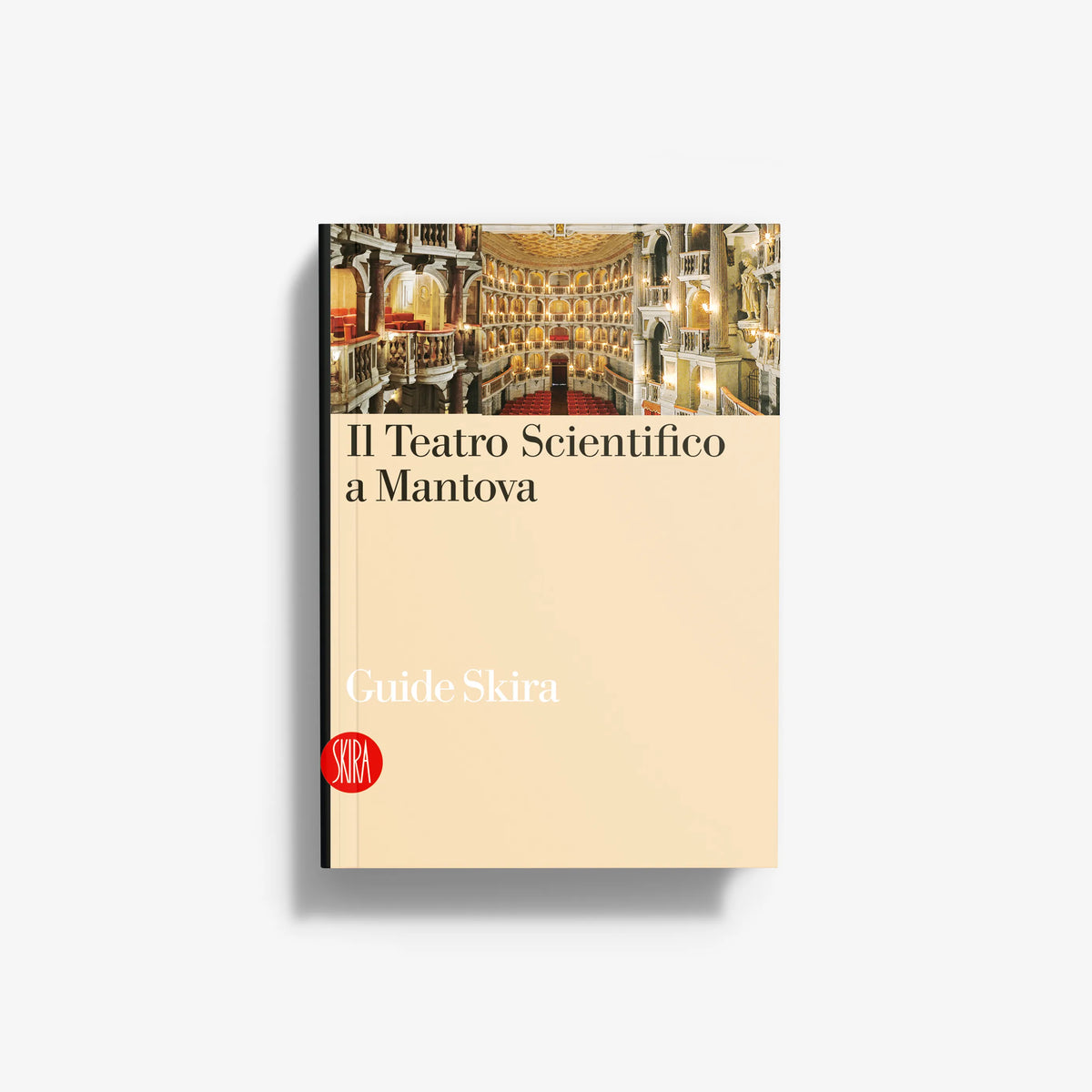 Travel guidebook with ornate theater photo and beige cover, softcover