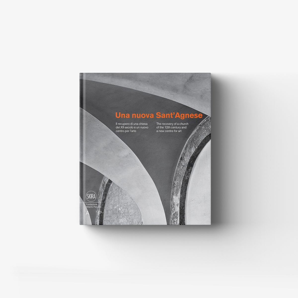 Art book in grey with orange title Una nuova Sant'Agnese by Skira Arte, with 12th century church recovery theme