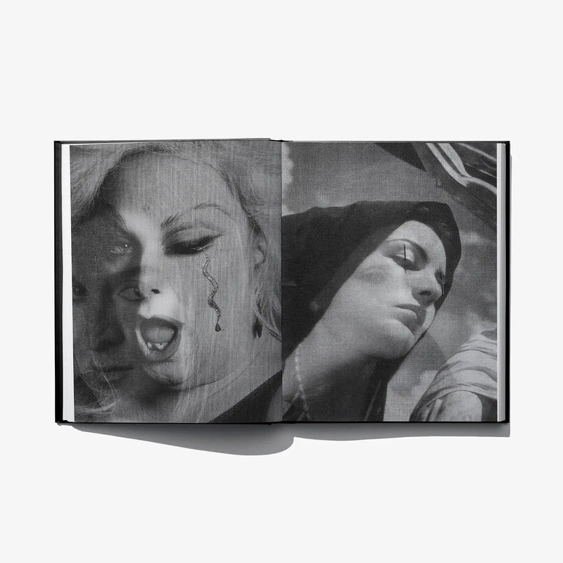 Open art book spread with monochrome face collage and stylized eye details