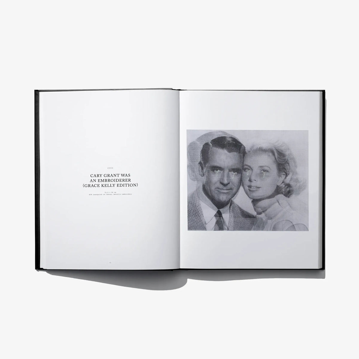 Open art book spread with black-and-white couple photo on the right page