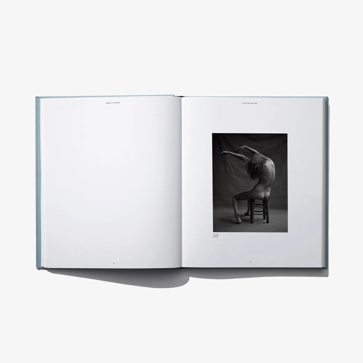 Open book spread with black-and-white portrait photo on right page