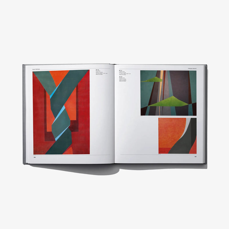 Art catalog open to geometric abstract paintings on two pages