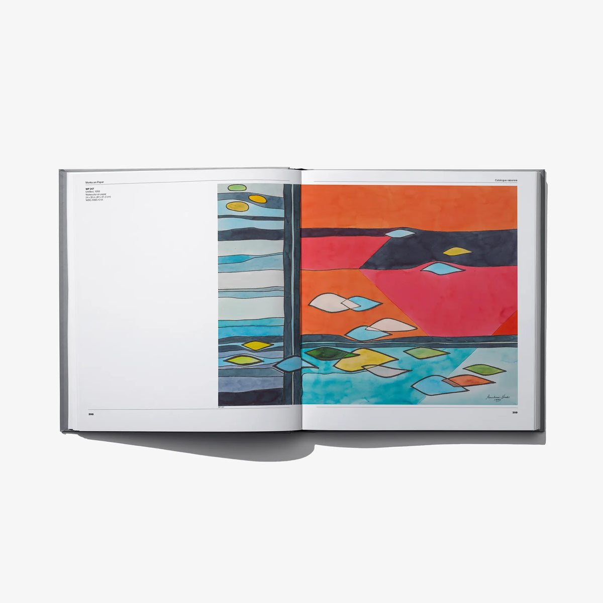 Wassef Boutros-Ghali catalog raisonné open to a colorful abstract artwork spread