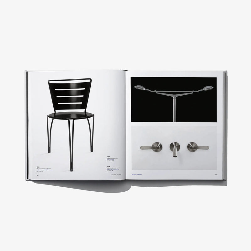 Open design book with black chair photo and close-up fixtures image