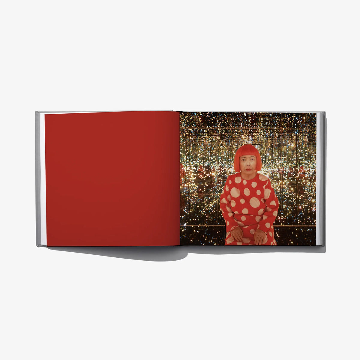 Open art book spread: red page left and polka-dot portrait on glittery backdrop