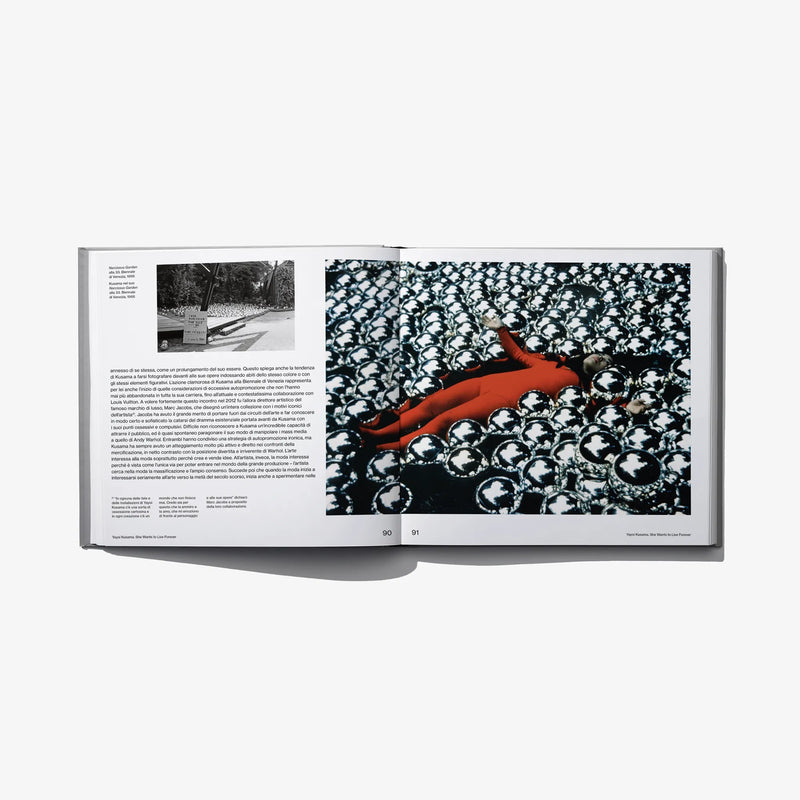 Open art book spread with black-and-white pattern and a red sculptural form