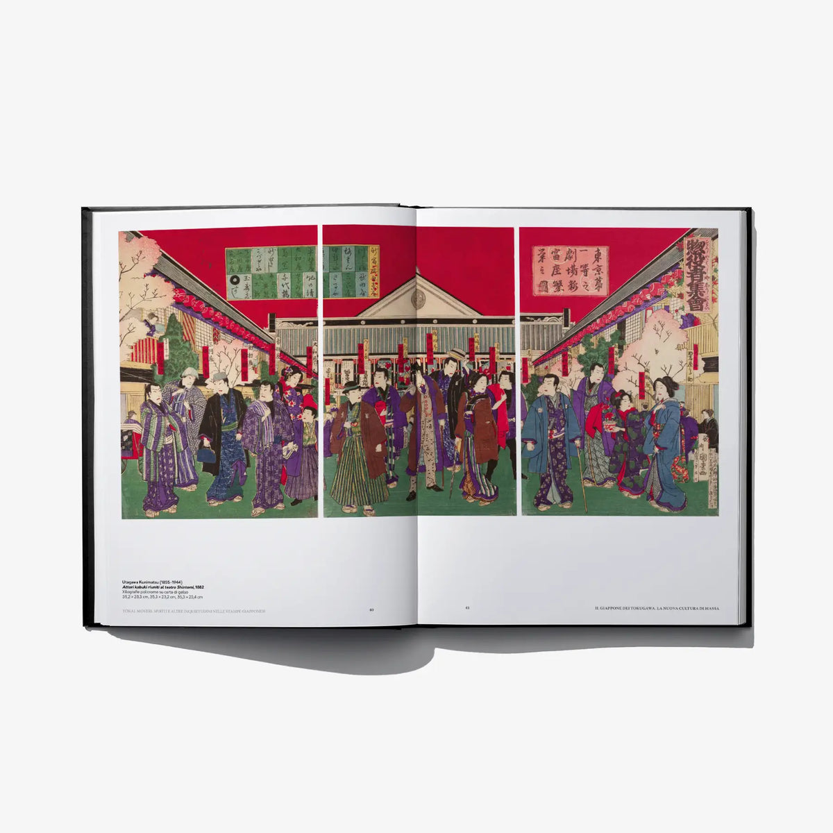 Open book spread showing crowd scene in traditional attire with red background